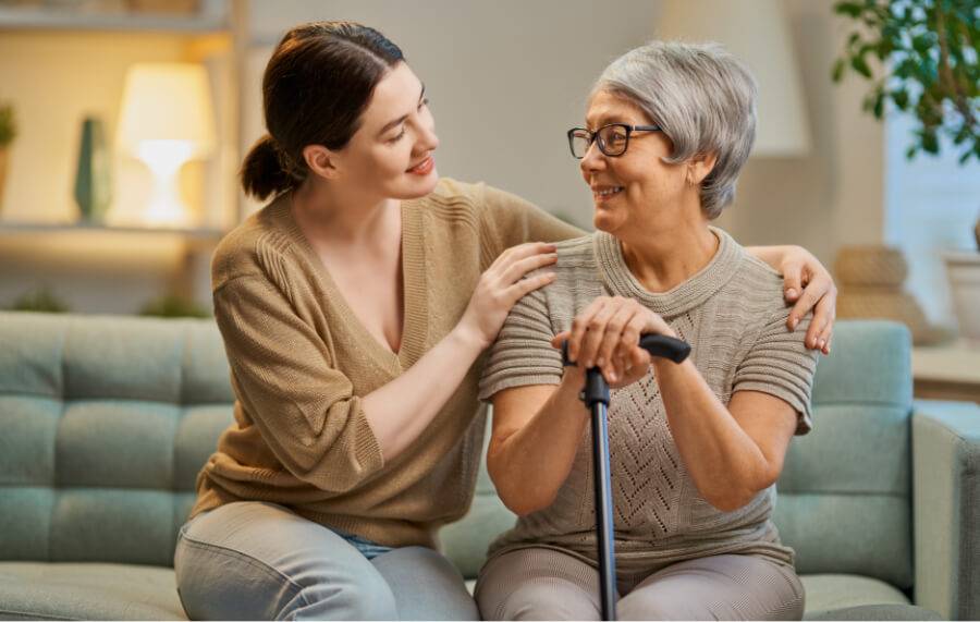 Caregiver giving emotional support to a old lady